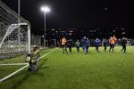 Det stærkeste seniorhold i den lokale fodboldklub ACFC træner om aftenen på kunstgræsbanen. 