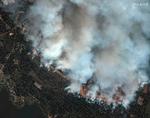Satellitbilleder viser ødelæggelserne ved lageret i byen Toropets. Foto: Handout/Ritzau Scanpix