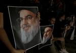 Hassan Nasrallahs tilhængere demonstrerer efter det israelske bombardement, der slog Hizbollah-lederen ihjel. Foto: Stringer/Ritzau Scanpix