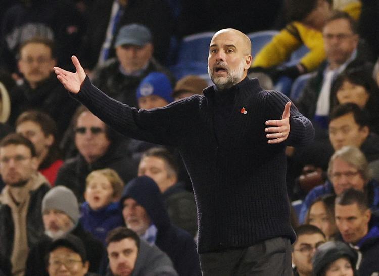 FILE PHOTO: Soccer Football - Premier League - Brighton &amp; Hove Albion v Manchester City - The American Express Community Stadium, Brighton, Britain - November 9, 2024 Manchester City manager Pep Guardiola reacts Action Images via Reuters/Paul Childs EDITORIAL USE ONLY.NO USE WITH UNAUTHORIZED AUDIO, VIDEO, DATA, FIXTURE LISTS, CLUB/LEAGUE LOGOS OR 'LIVE' SERVICES. ONLINE IN-MATCH USE LIMITED TO 120 IMAGES, NO VIDEO EMULATION.NO USE IN BETTING, GAMES OR SINGLE CLUB/LEAGUE/PLAYER PUBLICATIONS. PLEASE CONTACT YOUR ACCOUNT REPRESENTATIVE FOR FURTHER DETAILS../File Photo Foto: Paul Childs/Ritzau Scanpix
