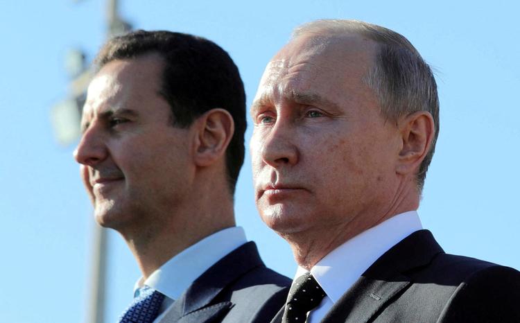 Bashar al-Assad., der her ses sammen med Putin tilbage i 2017, har fået asyl i Rusland. Arkivfoto   Foto: Sputnik Photo Agency/Ritzau Scanpix