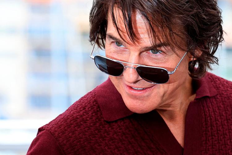 Den ellers notorisk pressesky 62-årige Tom Cruise overraskede publikum i Cannes ved pludselig at dukke op på scenen i en af festivalens store biografer.  Foto: Valery Hache/Ritzau Scanpix