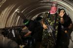 Hamas-krigere fra Ezz al-Din Al-Qassam-brigaderne skjuler sig og kæmper en svækket guerillakrig fra tunneler under Gaza. Foto: Mohammed Salem/Ritzau Scanpix