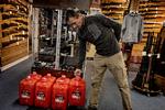 Rasmus Nilsson, who runs the Orsiivik shop, sells a lot of those big 20‑liter jugs of kerosene. Foto: Martin Lehmann