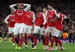 Arsenals William Saliba tager sig til hovedet i benovelse over Eberechi Ezes drømmemål mod Bayer Leverkusen i Champions League-ottendedelsfinalen. Foto: Andrew Boyers/Ritzau Scanpix