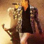 Simon Le Bon i front for Duran Duran, mens man ser John Taylor i baggrunden med sin patinerede mintgrønne bas. Foto: Thomas Borberg