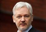 FILE - In this Feb. 5, 2016, file photo, WikiLeaks founder Julian Assange stands on the balcony of the Ecuadorean Embassy in London. WikiLeaks founder Julian Assange has released his statement to prosecutors in which he asserts he is innocent of committing sex crimes while visiting Sweden six years ago. In the statement released Wednesday, Dec. 7, 2016 he denied having sexual intercourse with a woman without using a condom while she was asleep. (AP Photo/Frank Augstein, File) 