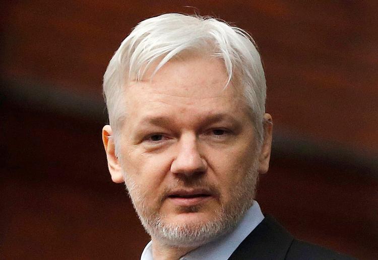 FILE - In this Feb. 5, 2016, file photo, WikiLeaks founder Julian Assange stands on the balcony of the Ecuadorean Embassy in London. WikiLeaks founder Julian Assange has released his statement to prosecutors in which he asserts he is innocent of committing sex crimes while visiting Sweden six years ago. In the statement released Wednesday, Dec. 7, 2016 he denied having sexual intercourse with a woman without using a condom while she was asleep. (AP Photo/Frank Augstein, File) 