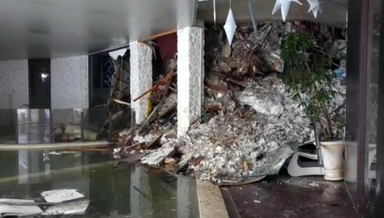 This photo taken from a video shows show piles of snow and rubble cascading down the stairway into the foyer of the hotel Rigopiano in Farindola, Italy, early Thursday, Jan. 19, 2017. A hotel in the mountainous region hit again by quakes has been covered by an avalanche, with reports of dead. Italian media say the avalanche covered the three-story hotel in the central region of Abruzzo, on Wednesday evening. (Italian Finance Police via AP) 