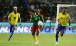 Kampen om det afrikanske mesterskab fortsætter for Christian Bassogog (i midten) efter 0-0 mod værtsnationen Gabon. 