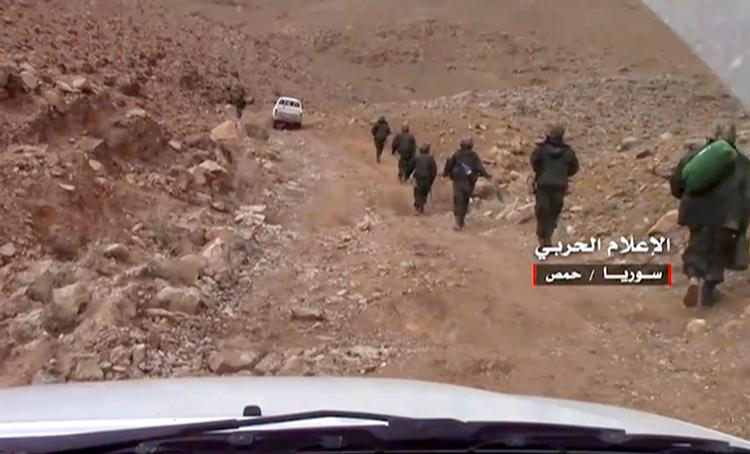 Syriske soldater har fået overtaget i kampen med IS i den historiske by Palmyra.  