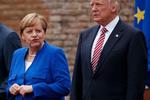 Angela Merkel og Donald Trump poserer til et fællesfoto med G7-lederne. 