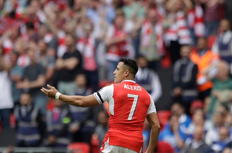Arsenals topscorer fra forrige sæson, chilenske Alexis Sanchez, vil gerne væk fra klubben, men puslespillet har haft svært ved at blive lagt helt på plads. 
   Matt Dunham/AP