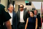 Tiger Woods og entourage ved retten.  