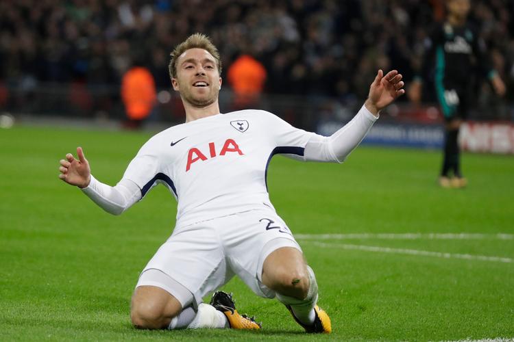 Tottenhams Christian Eriksen jubler efter sin scoring mod Real Madrid på Wembley i Champions League. Nu gælder det en lige så vigtig duel mod 'Gunners' lørdag eftermiddag.
   