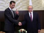 Vladimir Putin og Bashar al-Assad mødte hinanden på en luftbase. 