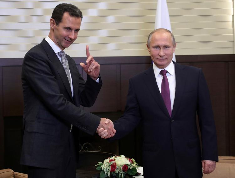 Vladimir Putin og Bashar al-Assad mødte hinanden på en luftbase. 