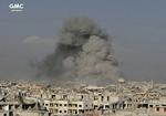 Regeringenstropper med støtte fra det russiske militær gennemfører et luftangreb i Ghouta. Billedet er offentliggjort af aktivistiske regeringsmodstandere fra Ghouta Media Center.
    Uncredited/AP