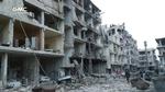 Civile i et af de bombede  områder i Ghouta. Flere hundrede civile har mistet livet de seneste 100 dage. Billedet er offentliggjort af aktivistiske regeringsmodstandere fra Ghouta Media Center.
   Uncredited/AP