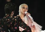 Lady Gaga har ikke fortalt meget om, at hun blev voldtaget, da hun var teenager. Men hun har skrevet to sange om det.  Matt Sayles/AP