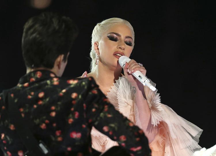 Lady Gaga har ikke fortalt meget om, at hun blev voldtaget, da hun var teenager. Men hun har skrevet to sange om det.  Matt Sayles/AP