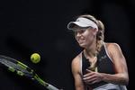 Caroline Wozniacki skal efter en hyggeoptræden i Parken mod Venus Williams levere varen på gruset i Madrid. Det bliver hårdt arbejde. Liselotte Sabroe/Ritzau Scanpix