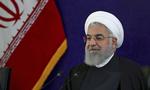 Irans præsident Hassan Rouhani siger, at landet bliver i aftalen om landets atomprogram. /AP