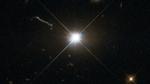 Et sort hul med en velvoksen appetit har skruet op for lysstyrken i den kvasar, der ledsager den. Sådan kan den tage sig ud på tættere hold. ESA/Hubble/Nasa