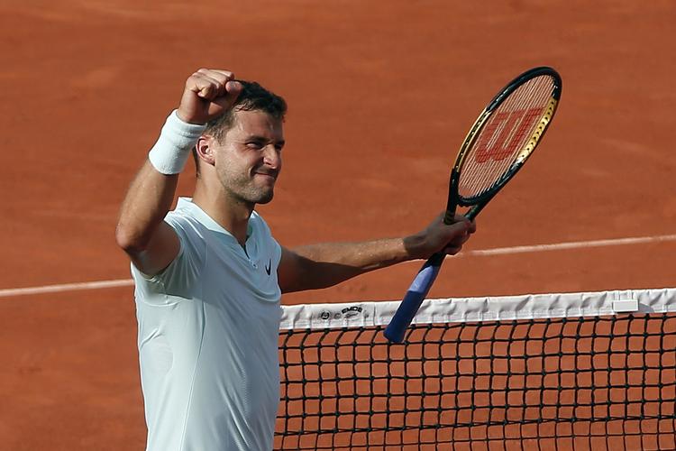 4 timer og 19 timer tog det bulgarske Grigor Dimitrov at nedkæmpe sin amerikanske modstander i Paris. Thibault Camus/AP