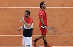 3 timer og 37 minutter tog det, før Mario Cilic (tv.) havde besejret italieneren Fabio Fognini (th.). Alessandra Tarantino/AP