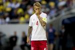 Den danske anfører Simon Kjær og holdkammeraterne får et svært VM, vurderer en computer.  Finn Frandsen/POLFOTO