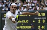 Når underlaget skifter fra grus til græs, skifter manden i hovedrollen navn fra Rafael Nadal til Roger Federer. Men niveauet holdes helt i top.   Daniel Leal-olivas/AP
