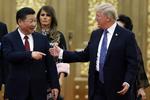 Der er startet en regulær handelskrig mellem de store nationer USA og Kina. Thomas Peter/AP