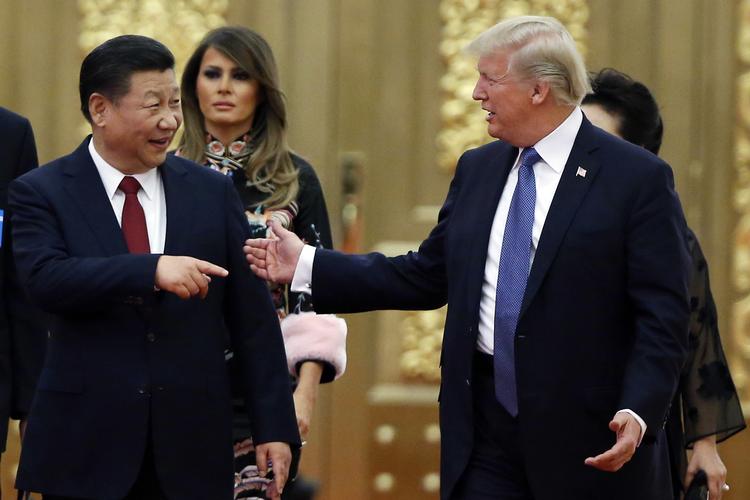 Der er startet en regulær handelskrig mellem de store nationer USA og Kina. Thomas Peter/AP