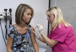 Studier af første årgang piger, der er blevet vaccineret mod hpv peger på, at de har haft glæde af den. John Amis/AP