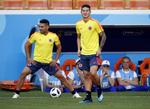 Med James Rodriguez (th). og Radamel Falcao (tv.) råder Colombia over et par stærke offensive kræfter. Eugene Hoshiko/AP