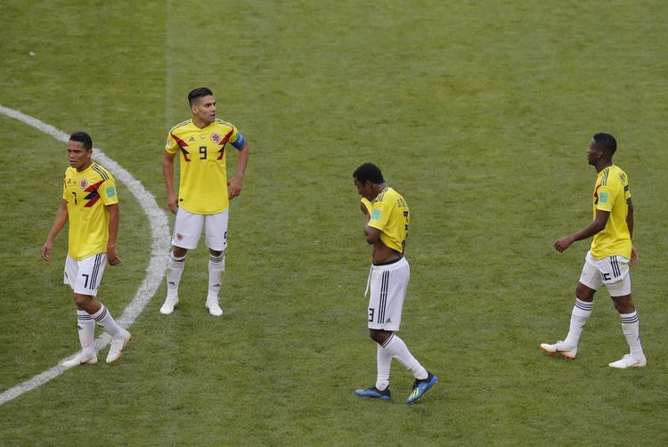 De colombianske spillere var forståeligt skuffede efter nederlaget mod Japan. Vadim Ghirda/AP
