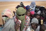 
    Migranterne overlades til deres egen skæbne uden mad ofg drikke i den varme ørken. Jerome Delay/AP