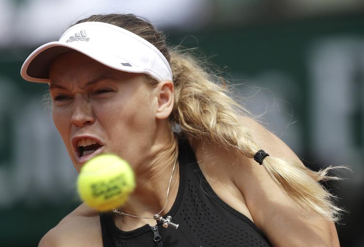 Caroline Wozniacki er kommet i gang på græsset før det kommende Wimbledon, og onsdag tog hun sin første sejr i Eastbourne.
   Alessandra Tarantino/AP