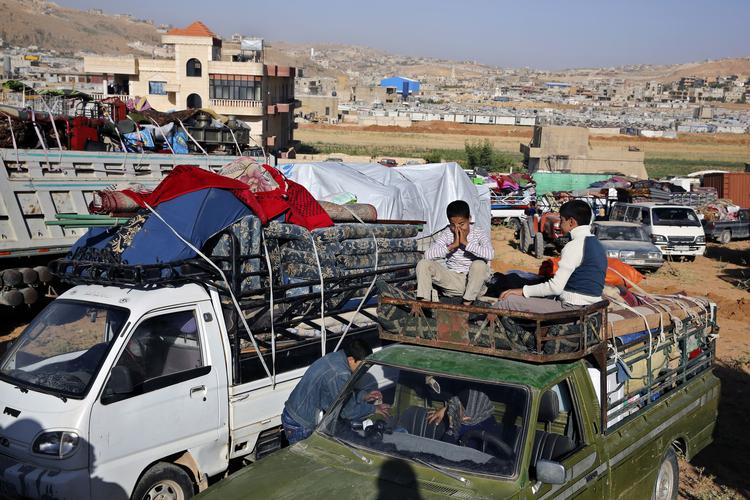 Syriske flygtninge ved grænsen til Libanon. Flygtningestrømmen har længe været ved at splitte EU. Arkivfoto. Bilal Hussein/AP