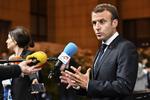 Frankrigs Emmanuel Macron fortæller om den nye migrantaftale, der netop er indgået i Bruxelles.  Geert Vanden Wijngaert/AP