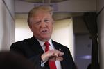 
   Protesterne mod s President Donald Trump, speaks to reporters onboard Air Force One Friday, June 29, 2018, on his way to Bedminster, N.J. (AP Photo/Manuel Balce Ceneta)
   Manuel Balce Ceneta/AP