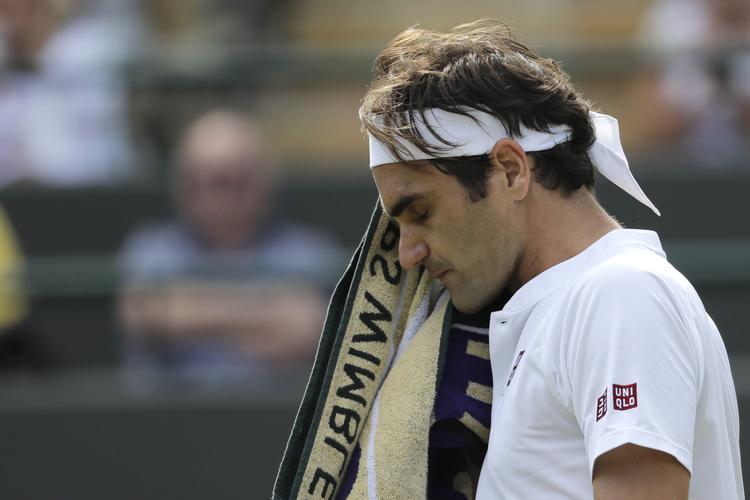 Roger Federer må komme tilbage om et år, hvis han vil have sin 9. titel i Wimbledon.   Ben Curtis/Ritzau Scanpix