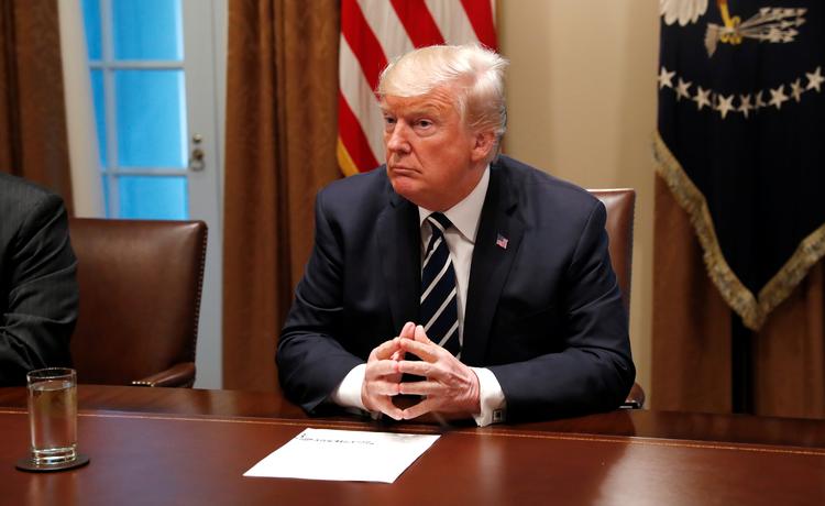 Trump havde tirsdag på pressemøde travlt med at forklare sig.  Leah Millis/Ritzau Scanpix