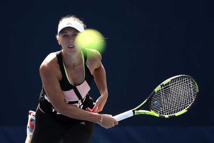 Caroline Woznaicki under træning ved US Open, hvor hun ikke viser det til omgivelserne, hvis der stadig er lidt at mærke fra skaderne. 
   Julian Finney/Ritzau Scanpix