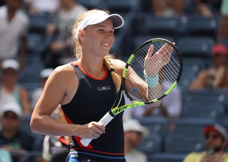 Der er god stemning i Wozniacki-lejren oven på den sikre sejr i 1. runde ved US Open, og danskeren er også storfavorit i torsdagens kamp. 
   Timothy A. Clary/Ritzau Scanpix