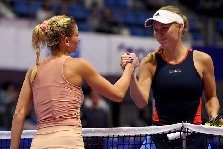 Det var, meget forståeligt, et lidt anstrengt smil, Caroline Wozniacki sendte Camila Giorgi, da danskeren havde tabt i Tokyo tidligere på ugen. Toshifumi Kitamura/Ritzau Scanpix