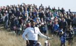 I den amerikanske lejr tror stjernen Tiger Woods stadig på, at weekenden kan ende lykkeligt og at USA kan genvinde Ryder Cup. (AP Photo/Alastair Grant)
   Alastair Grant/AP