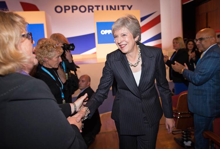 Theresa May i fint humør på den konservative kongres.   Stefan Rousseau/Ritzau Scanpix