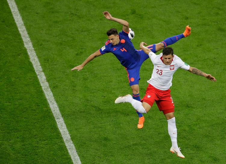 Dawid Kownacki (th.) i aktion mod Colombia ved Polens ikke ret gode VM-slutrunde. Sergei Grits/AP